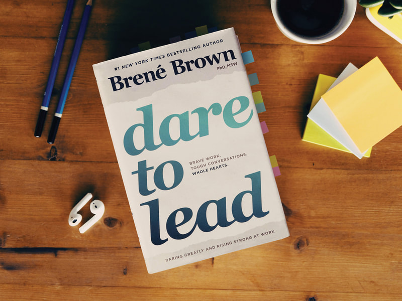 brene brown dare to lead book on a desk